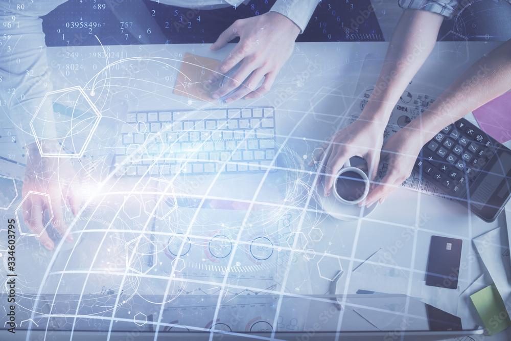 Naklejka premium Double exposure of man and woman working together and world map hologram drawing. international network concept. Computer background. Top View.