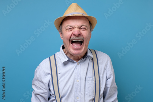 Senior angry and mad man screaming frustrated and furious, shouting with anger © Viktor Koldunov