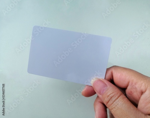 hand holding blank business card