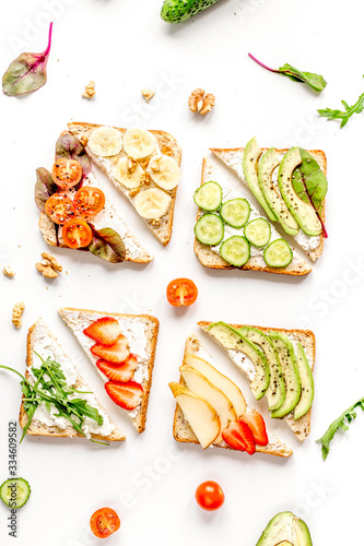 fitness breskfast with homemade sandwiches white table background top view photo