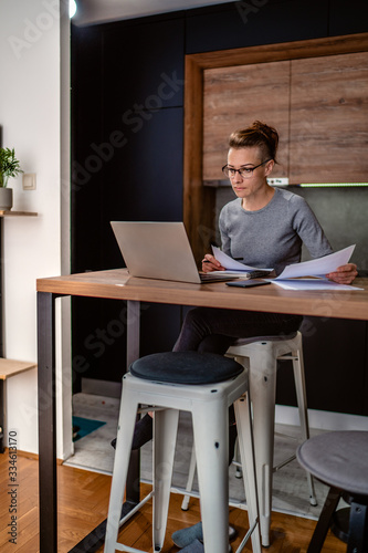 woman working from home in quarantine isolation Covid-19 photo
