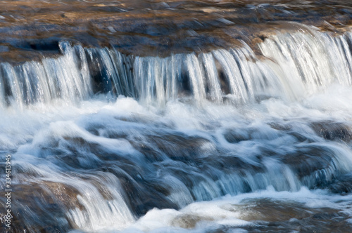 Baird Creek waterfall in slow motion, on the Niagara Escarpment, close-up view.