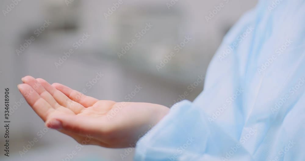Covid-19 Coronavirus - Doctor is Desinfecting Hands with Germicidal Gel Covid-19 Coronavirus - Doctor is Desinfecting Hands with Germicidal Gel