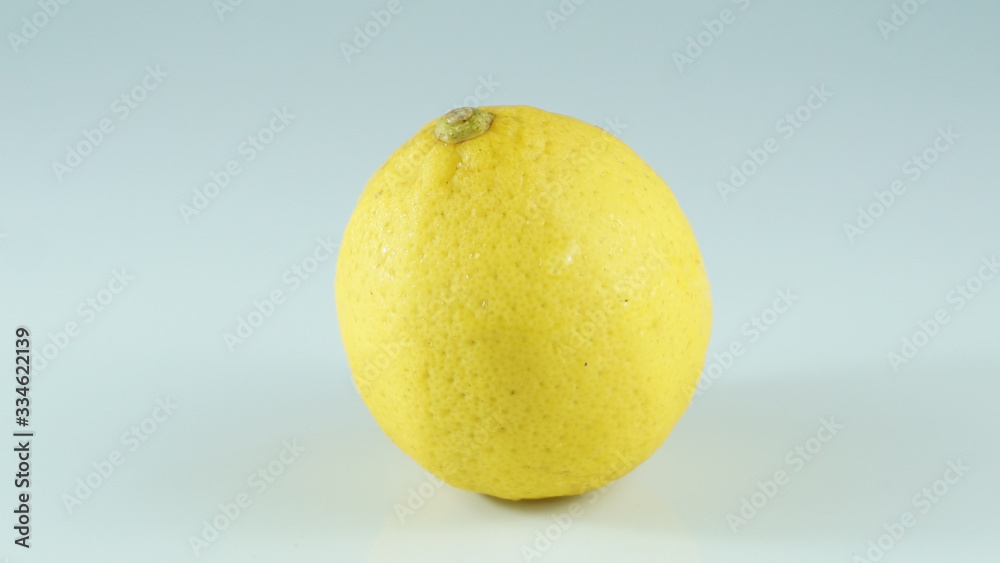 One lemon isolated on white background. Tropical fruit One lemon isolated on white background. Tropical fruit