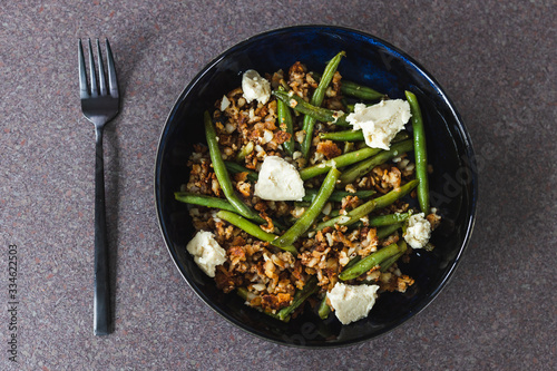 healthy plant-based food, crumbed hash brown with green beans and homemade vegan mozzarella made of cashews