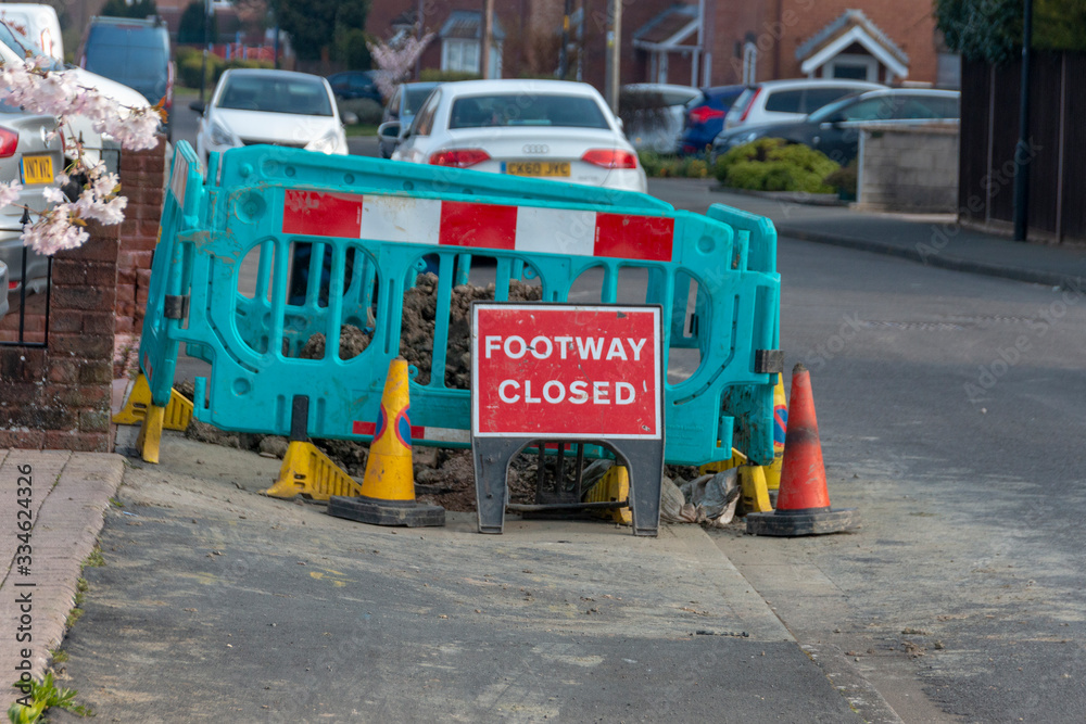 Bristol-March 2020-England-a close up view of a warning sign to say the footway was closed due to renervations and road workers
