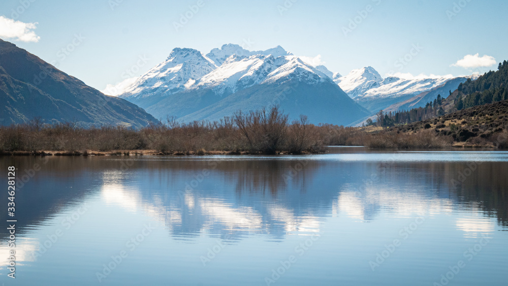 Symetric landscape shot with mountain reflected in lake.Shot made in Glenorchy, New Zealand