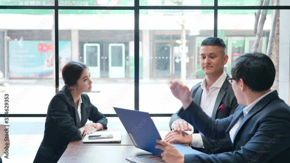 Group Business people meeting and working in cafe. Share idea, Brainstorming and Teamwork concept. Group Business people meeting and working in cafe. Share idea, Brainstorming and Teamwork concept.