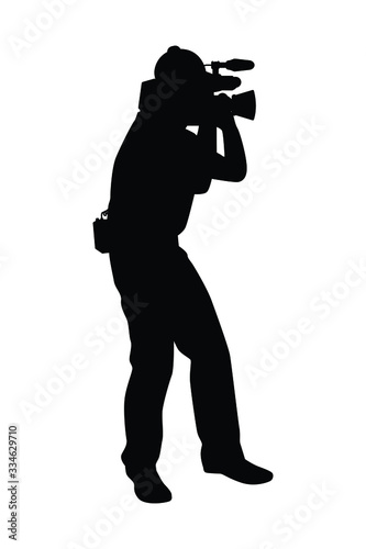 Man with movie video recorder in hand silhouette