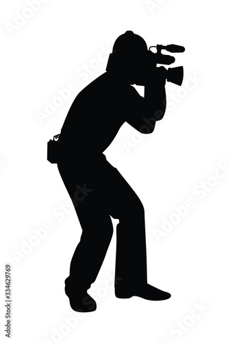 Man with movie video recorder in hand silhouette