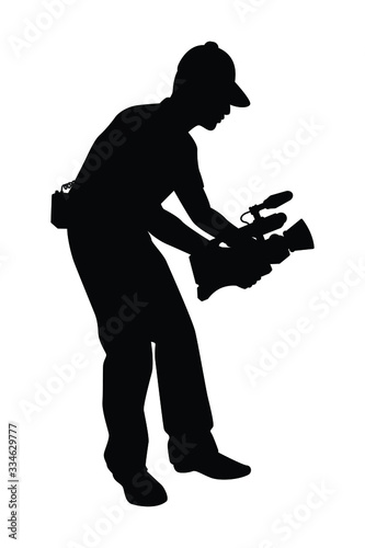 Man with movie video recorder in hand silhouette