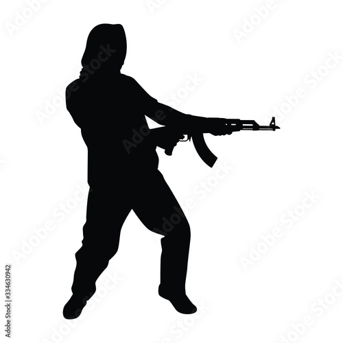 Terrorist with gun silhouette