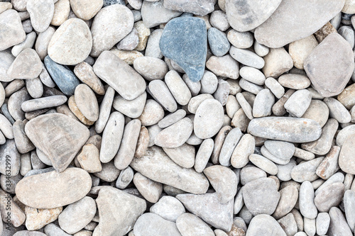 Smooth pebbles close-up on the sea coast