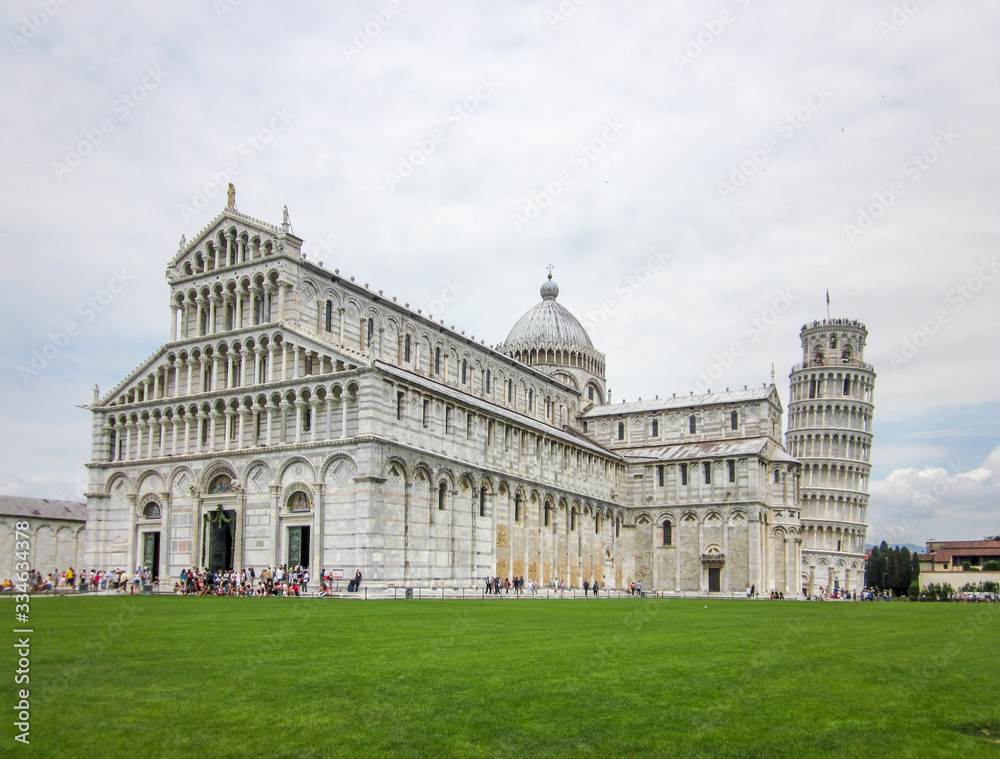 A shot of the Pisa Cathedral and the leaning tower of Pisa with tourists
