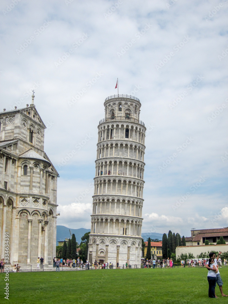 A shot of Leaning tower of Pisa with tourists