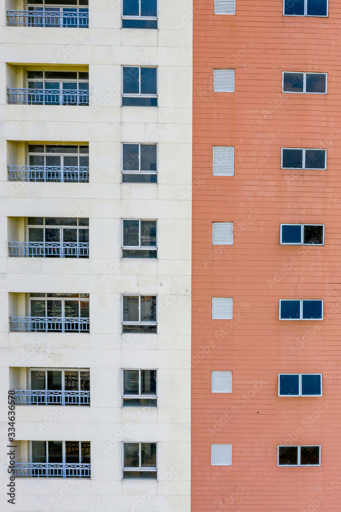 Multiple of balconies and windows of apartment building for background