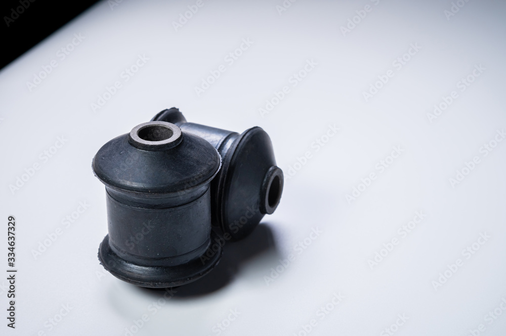 Two silent blocks on a gray background. New car suspension parts Two silent blocks on a gray background. New car suspension parts