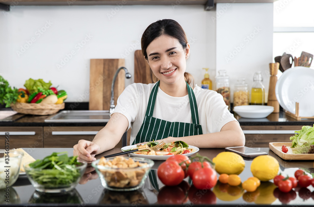 Woman eating vegetable salad