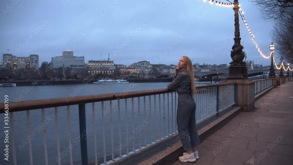 Teenage Girl In Jumpsuit Looking Over Thames Teenage Girl In Jumpsuit Looking Over Thames