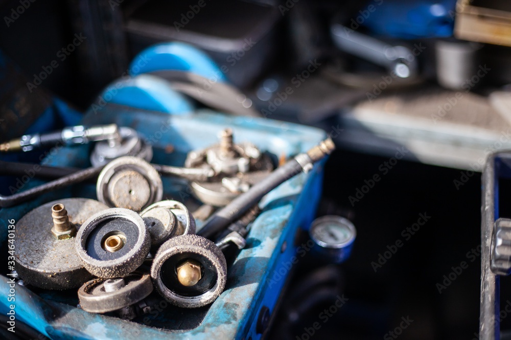 tools and toolboxes in auto mechanics garage