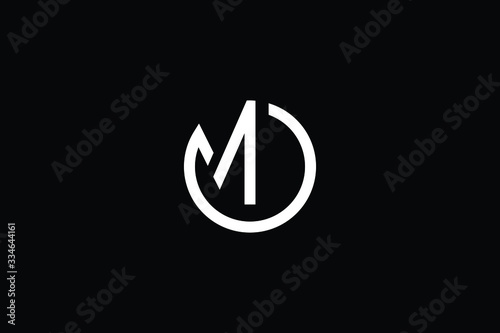 Minimal elegant monogram art logo. Outstanding professional trendy awesome artistic MO OM initial based Alphabet icon logo. Premium Business logo White color on black background photo