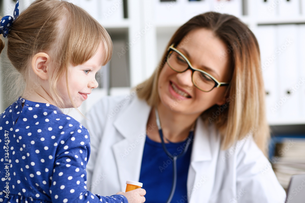 Little child with mother at pediatrician reception. Physical exam cute infant portrait baby aid healthy lifestyle ward round child sickness clinic test high quality and trust concept Little child with mother at pediatrician reception. Physical exam cute infant portrait baby aid healthy lifestyle ward round child sickness clinic test high quality and trust concept