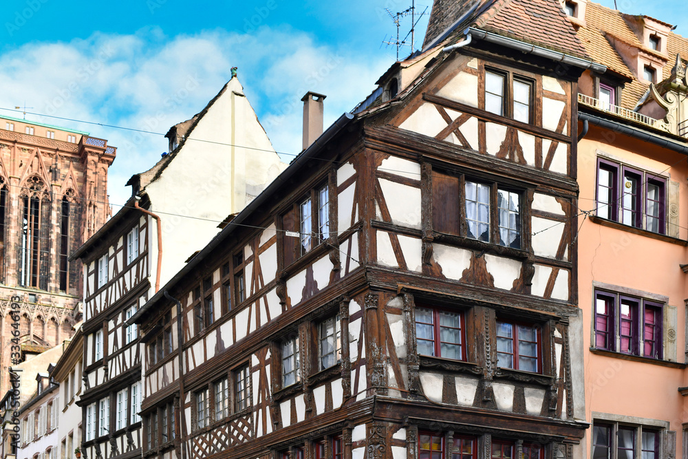 Corner of traditional European style half timbered frame house in historical city center of Strasbourg in France