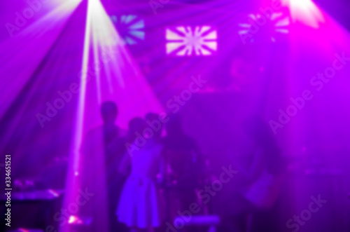 Abstract blur Light And Silhouette in club party is blurred for background