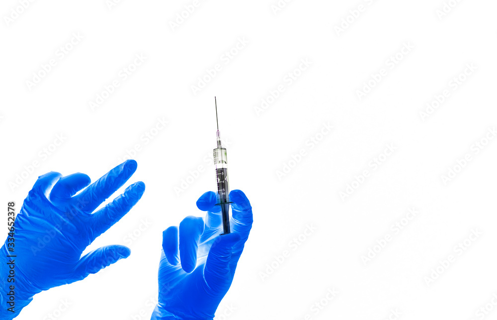 The hands holding medical syringe. The hands holding medical syringe.