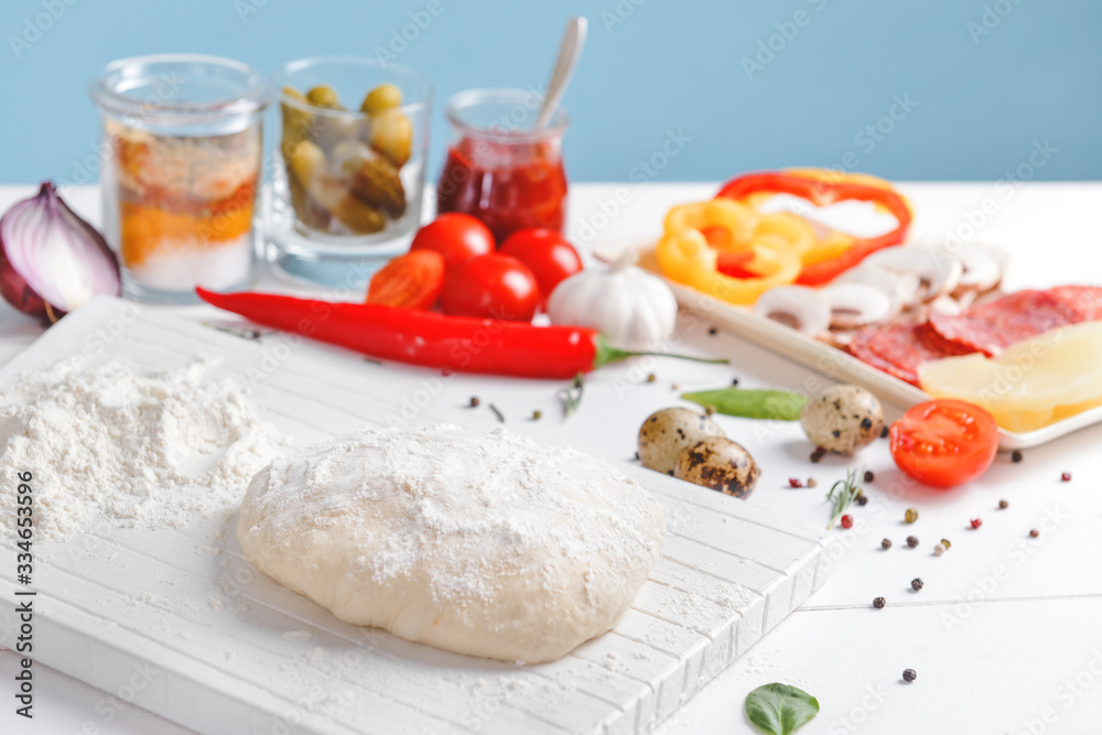 Ingredients for tasty pizza on table