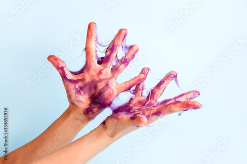 Sweet caramel paste for sugaring purple color on female hand, touch sensative creative idea, hair removal concept, beautician industry, banner flyer coupon for spa salon, depilate skincare procedure