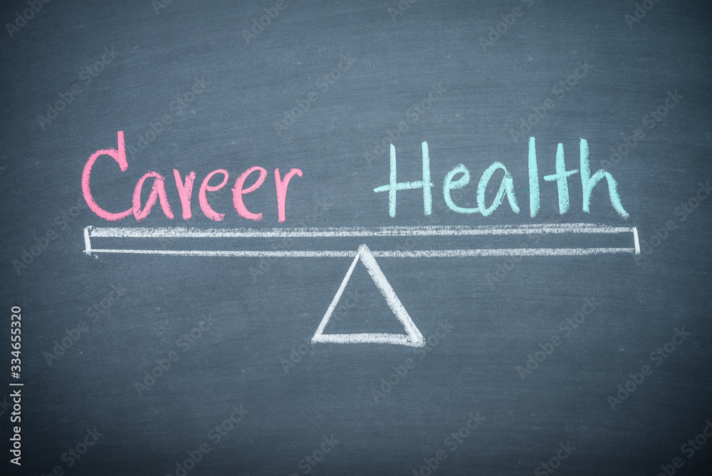 Career and health balance lifestyle management concept. Text word career and health handwriting on seesaw drawing on wooden chalkboard or blackboard. Work or career and health balance lifestyle. Career and health balance lifestyle management concept. Text word career and health handwriting on seesaw drawing on wooden chalkboard or blackboard. Work or career and health balance lifestyle.