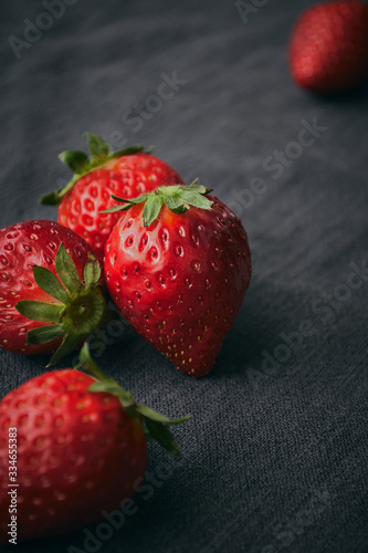 Close up of a fresh strawberries with leaves and selective focus.
