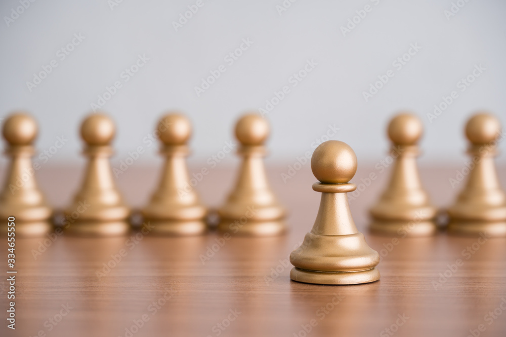 Concept of leadership, think different and recruitment employee. Pawn chess leading others on wooden table. Leadership skills need for top management in organization, company such as manager, CEO Concept of leadership, think different and recruitment employee. Pawn chess leading others on wooden table. Leadership skills need for top management in organization, company such as manager, CEO