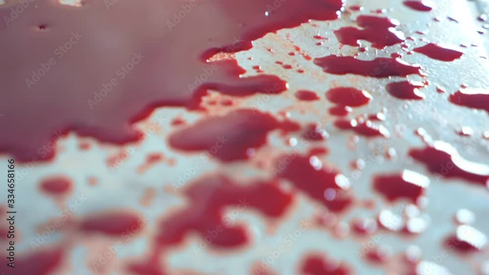 closeup. blood drips to the floor. a pool of blood on the floor