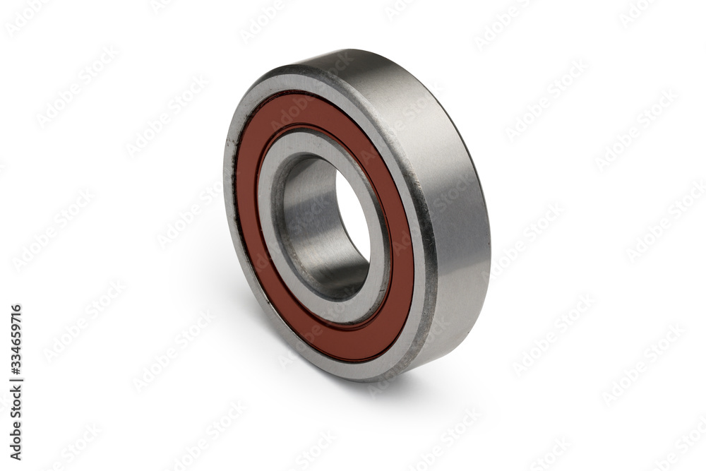 Isolate. Metal ball bearing with a red ring. Close-up. White background. Vertical view. Isolate. Metal ball bearing with a red ring. Close-up. White background. Vertical view.