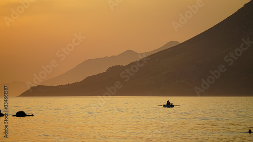 Riding a boat in the last rays of the sun. Quiet harbor of the Adriatic Sea near the village of Julian on the Peljesac Peninsula, Croatia