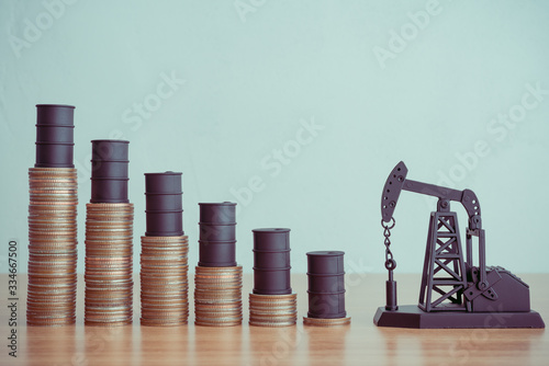 Принти на полотні Oil pump jack and barrels on step stack coins as graph down