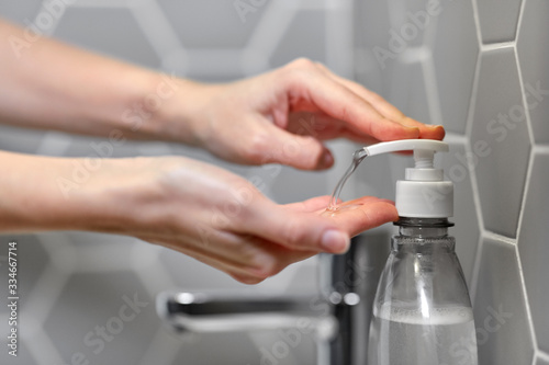 hygiene  health care and safety concept - close up of woman washing hands with liquid soap