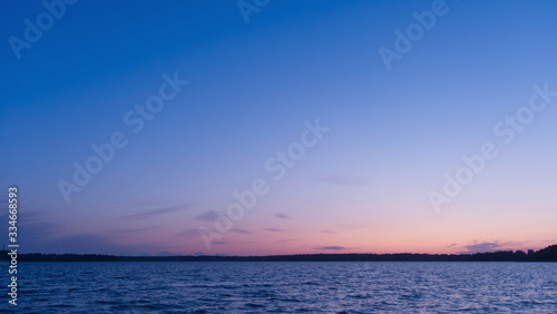 Lake at sunset; beautiful blue sky