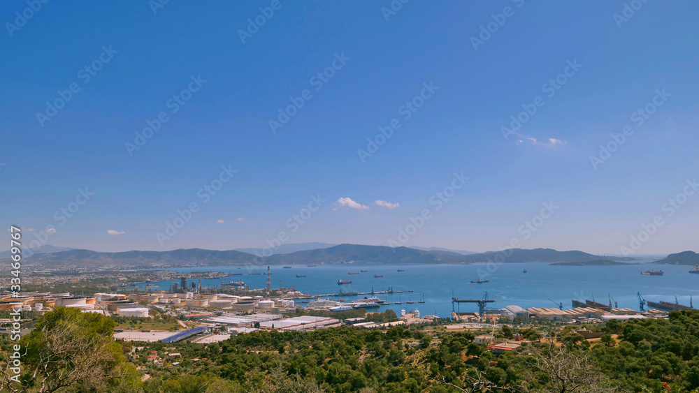 Aerial panoramic view of Lemos, Vouliagmeni, Greece under blue sky; Blue sky and beautiful city
