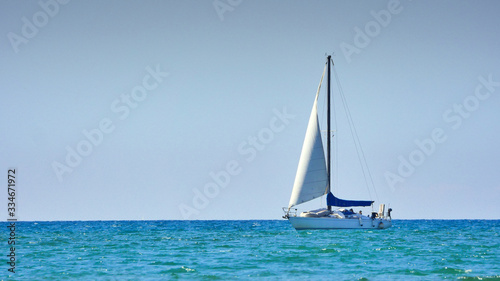 A sailboat in the blue sea
