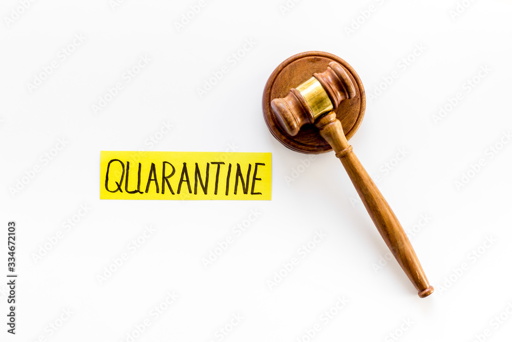 Quarantine fine. Judge gavel on white background top-down Quarantine fine. Judge gavel on white background top-down