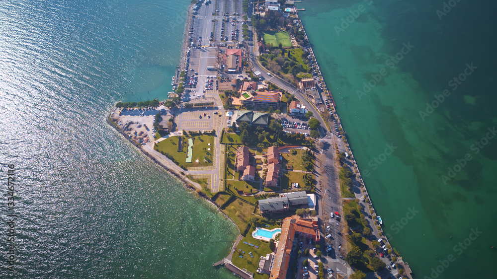 Aerial view of harbor and village houses; beautiful scenery of small town in Sirmione, northern Italy