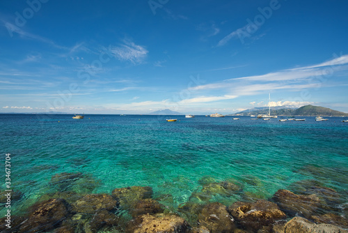 Fototapeta Naklejka Na Ścianę i Meble -  Aerial view of beautiful seascape of Capri Island under blue sky