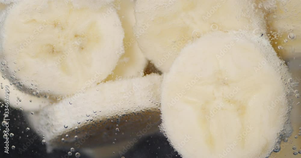 Slices of fresh banana under water. Slices of fresh banana under water.