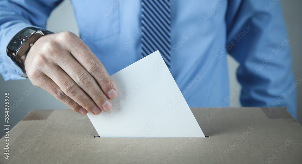 Man putting ballot in election box. Democracy. Freedom Man putting ballot in election box. Democracy. Freedom
