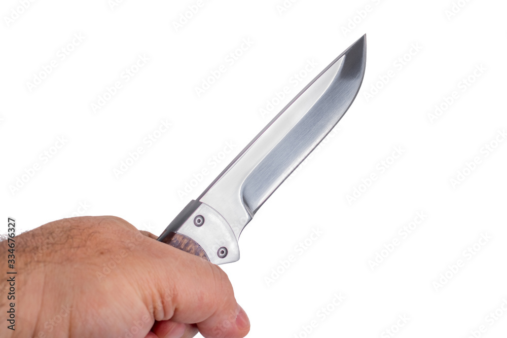 hunting knife in a hand isolated on white background hunting knife in a hand isolated on white background