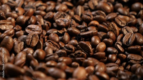 Spinning around coffee beans. Coffee beans. Coffee. Drink. The production of coffee. Close-up.