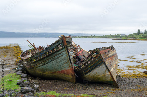 A very interesting spot in Mull island  in the inner Hebrides in Scotland. Two old wooden boats  once nice and colorful  left on the beach became almost a landmark for their adaptation with this place